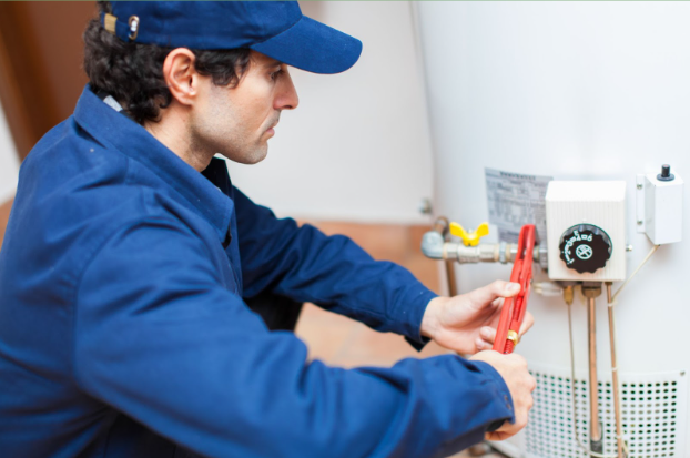 a plumber finishing up a hot water installation