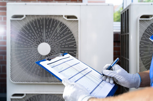 HVAC tech going through a systems checklist